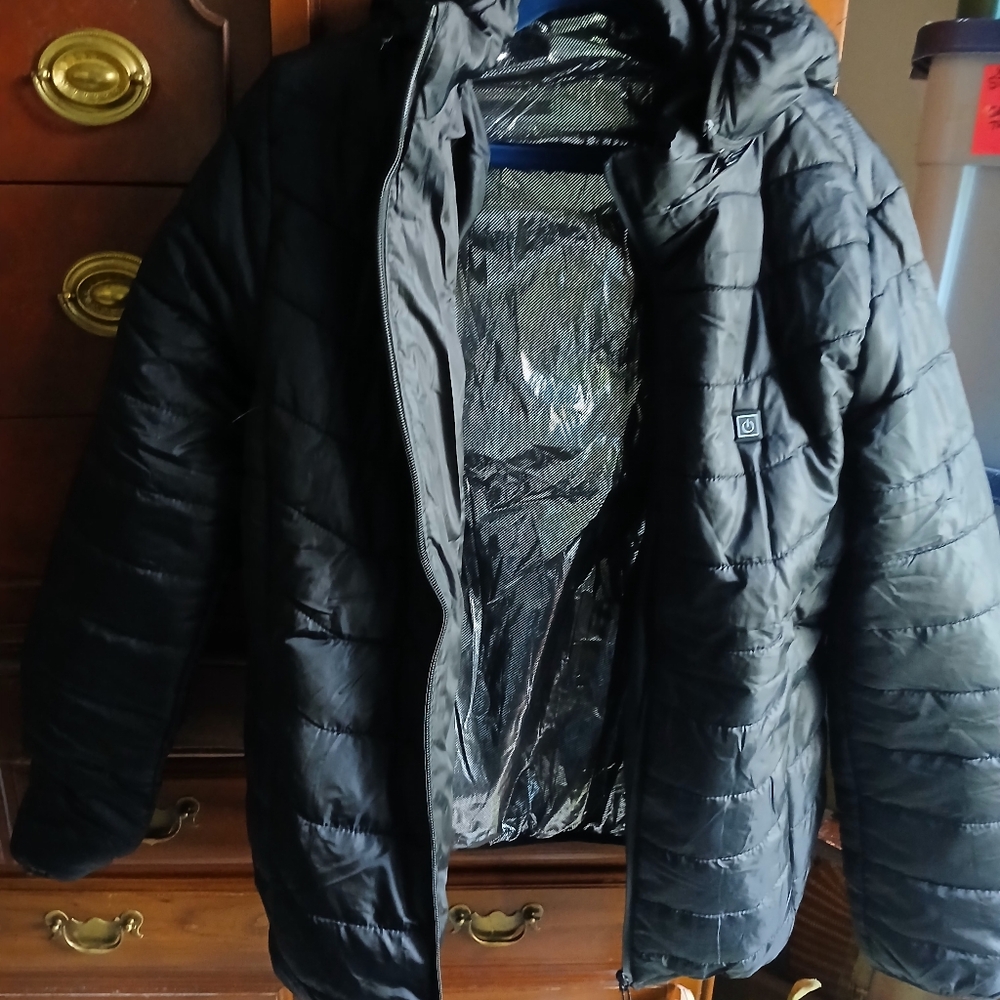 A black hooded 3xl heated kid or teen coat. It was never worn.